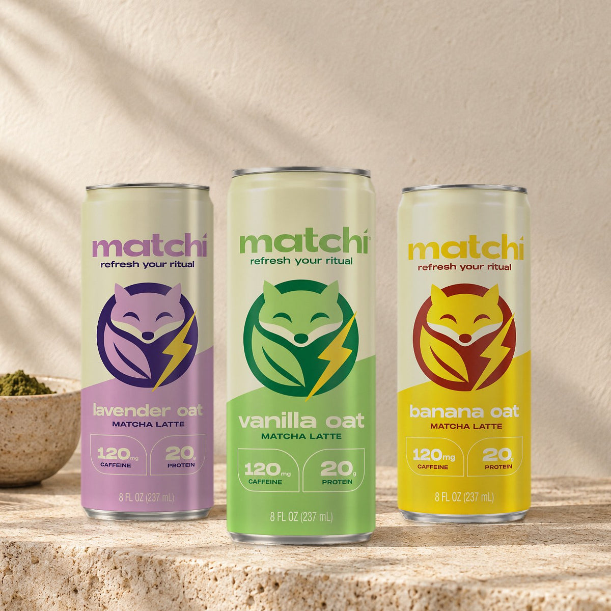 Matchi Lavender Oat, Vanilla Oat and Banana Oat canned matcha lattes on a stone counter, 8 fl oz cans